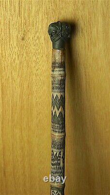 19th/ 20th C WALKING CANE, AFRICAN SCRATCH CARVED BAMBOO WITH 3 HEADED KNOB