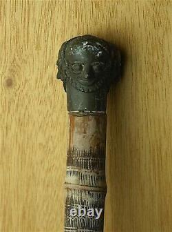 19th/ 20th C WALKING CANE, AFRICAN SCRATCH CARVED BAMBOO WITH 3 HEADED KNOB