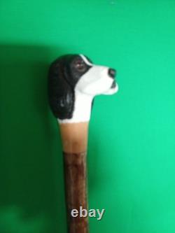 A Hand Carved Figure Of A Dogs Head Out Of Lime Timber