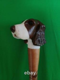 A Hand Carved Figure Of A Dogs Head Out Of Lime Timber