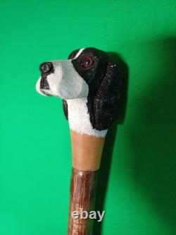 A Hand Carved Figure Of A Dogs Head Out Of Lime Timber