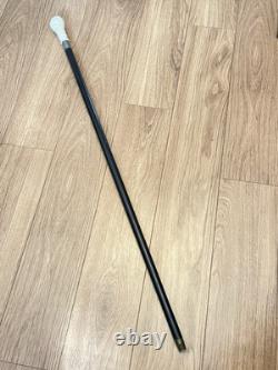 Antique Black Laquered Walking Stick With Carved Wooden Floral Motif Handle