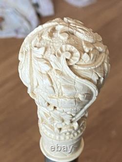 Antique Black Laquered Walking Stick With Carved Wooden Floral Motif Handle