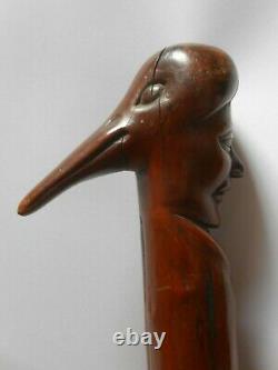 Antique English hand carved wooden walking stick plague mask faces with text