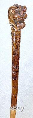 Antique Vintage Hand Carved Chinese Woo Dog Glass Eye Swagger Walking Stick Cane