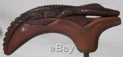 Carved wooden alligator that was made to be a handle for a walking stick