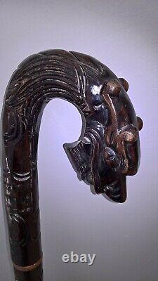 Chinese carved hardwood dragon walking stick with brass base lovely item