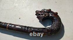 Chinese carved hardwood dragon walking stick with brass base lovely item