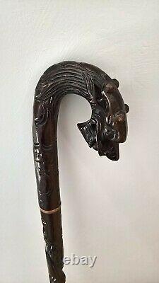 Chinese carved hardwood dragon walking stick with brass base lovely item