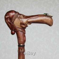 Custom walking cane Man in stocking cap with fly on the nose Hand carved walking