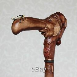Custom walking stick cane Man in stocking cap with fly on the nose Hand carved