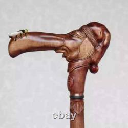 Walking cane Man in stocking cap with fly on the nose Hand carved walking stick