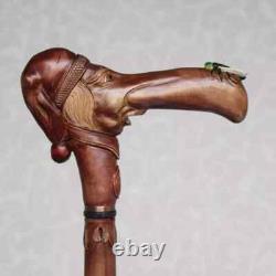 Walking cane Man in stocking cap with fly on the nose Hand carved walking stick